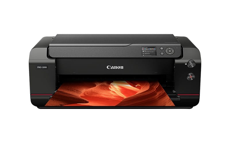 Canon imagePROGRAF PRO-1000 printer printing a vibrant landscape photo.