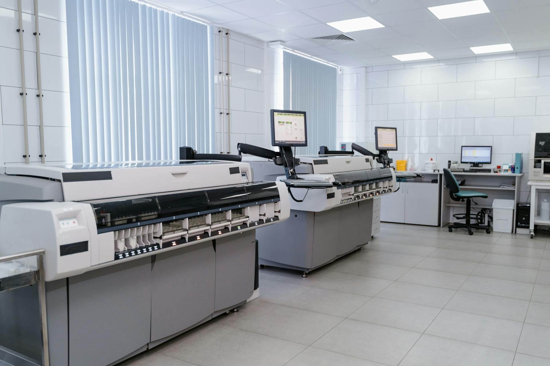 Modern medical laboratory with automated analyzers for efficient blood testing.