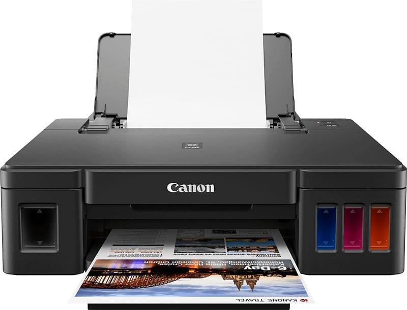 Canon PIXMA G1411 printer with ink tanks and paper