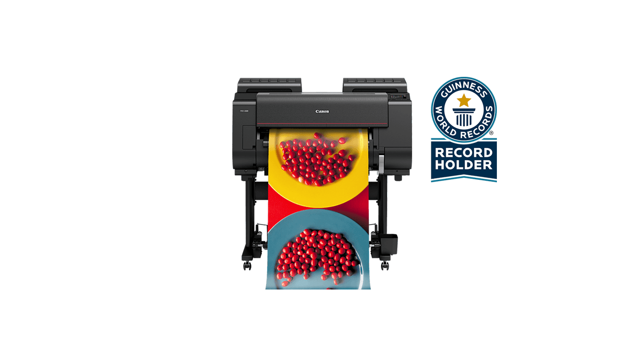 Canon imagePROGRAF PRO-2100 printer printing vibrant image of colorful plates and red berries. Guinness World Record holder.